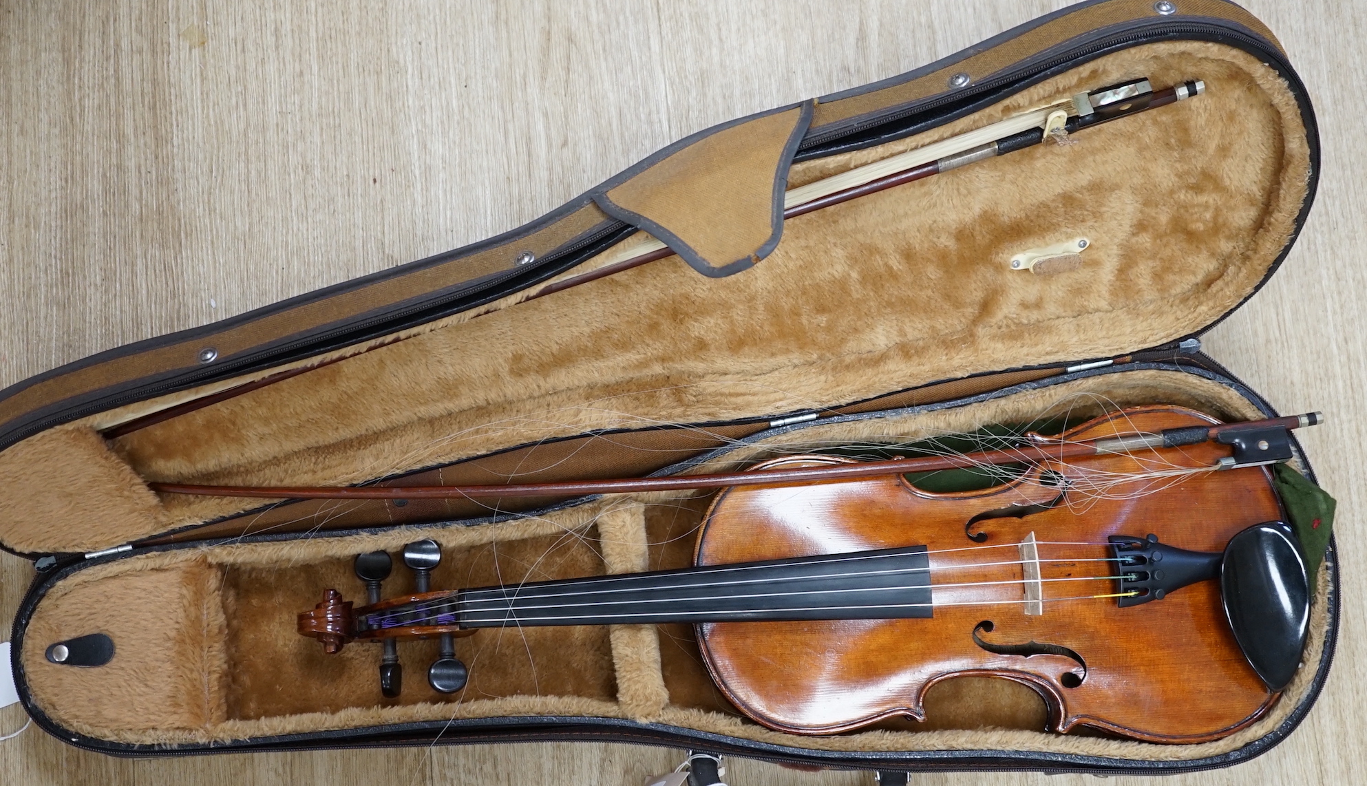 A cased 19th century German violin with paper label for August Hensel, length of body, 36cm, with two bows, CITES submission references, FBHZDSA1 and ZCXXMHV4